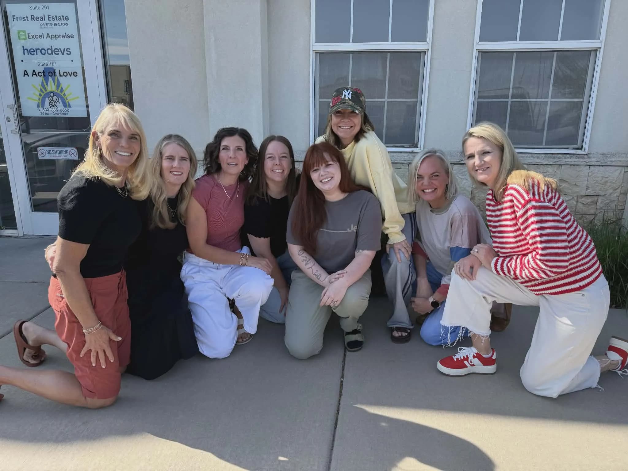 The real A Act of Love birth parent team outside the Sandy, Utah office