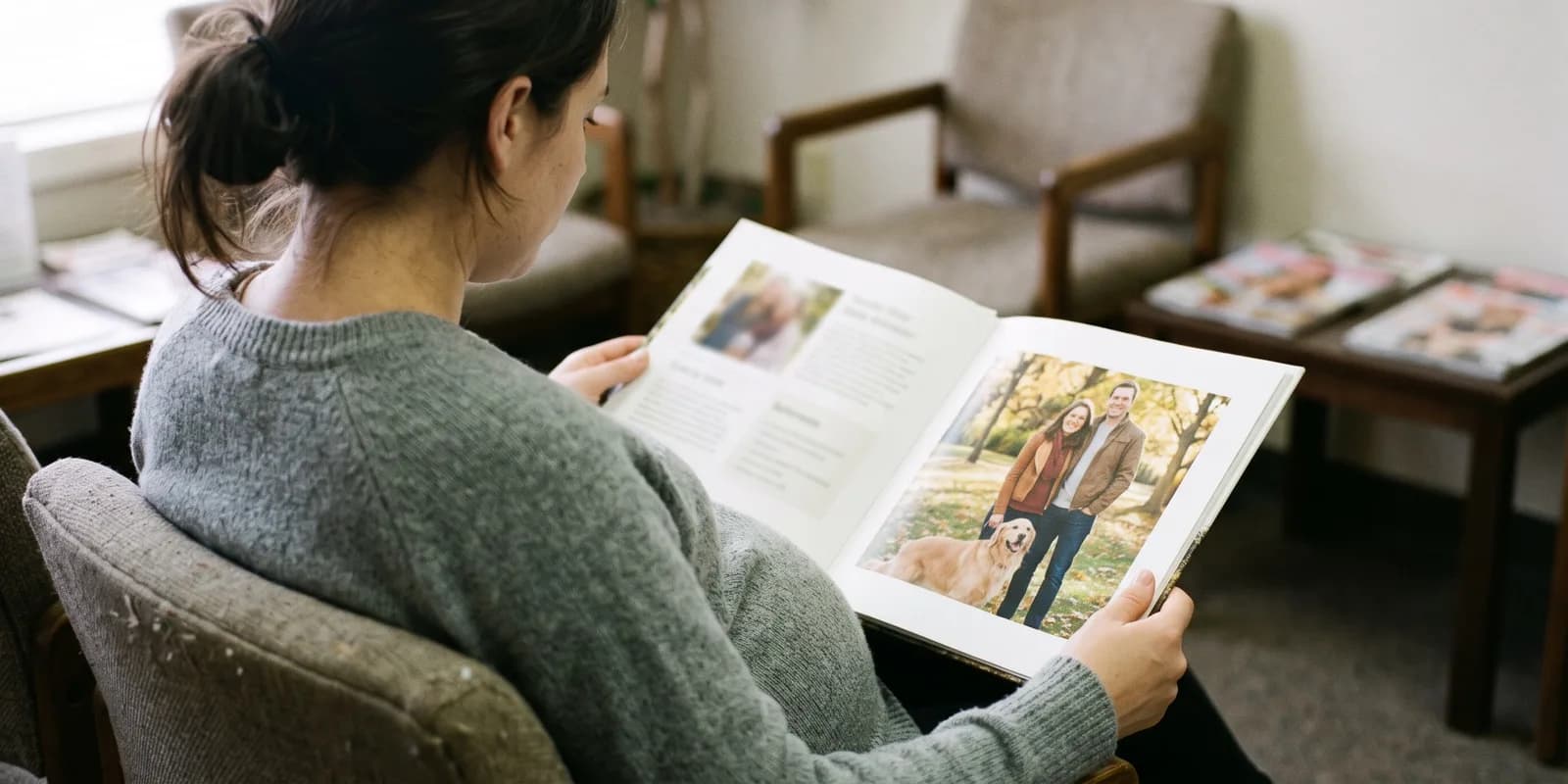 Ask how many waiting families have completed a home study before you are shown any A pregnant woman looking through a printed adoptive family profile book showing a couple with their dog