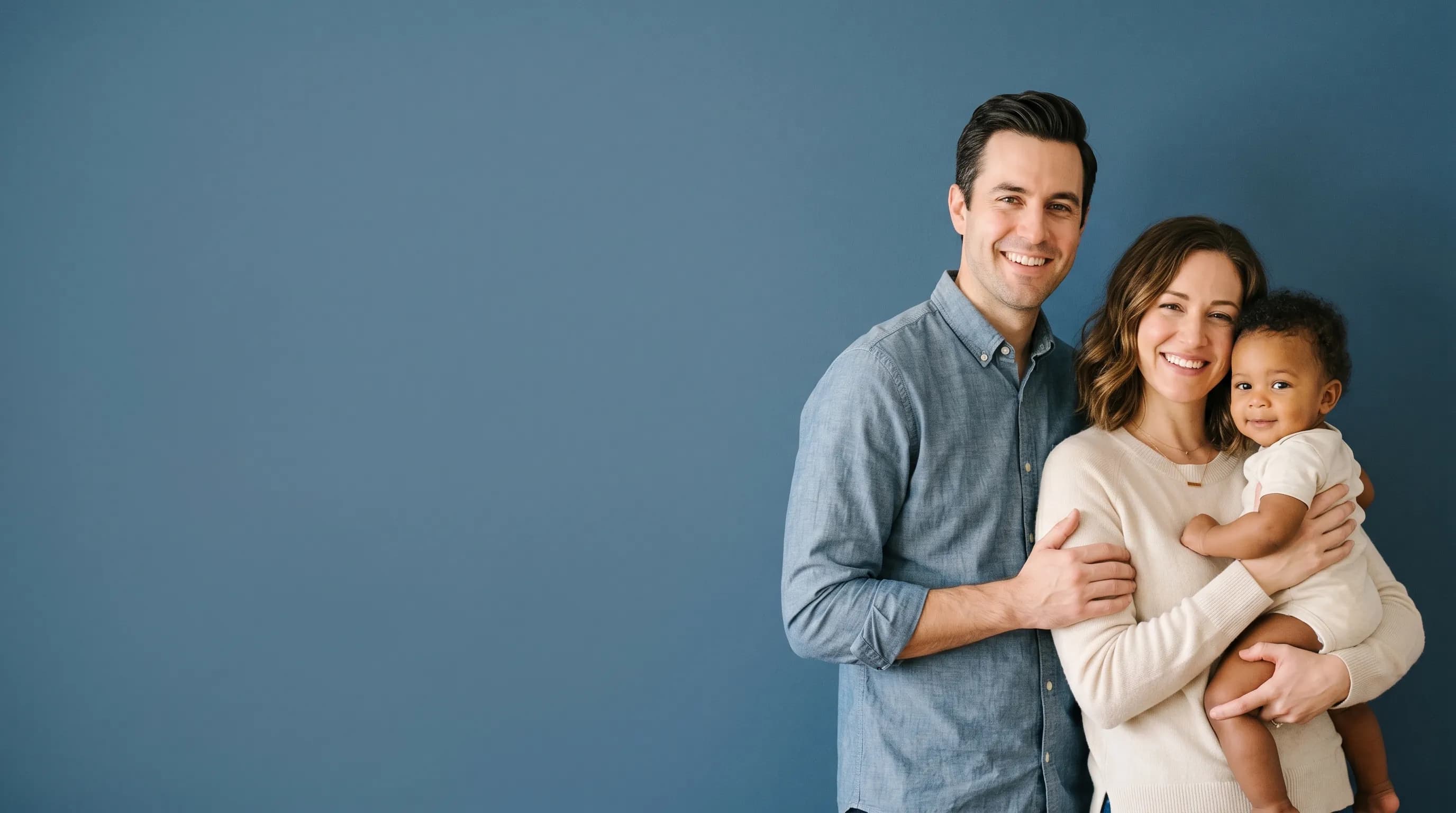 A hopeful adoptive family in a warm, candid moment together